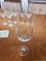 Front view of one flute with others in background showing cut pattern and stem