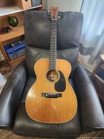 Full front view of Sigma GCS-6 guitar on chair