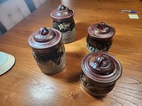 Full set of four canisters on tabletop