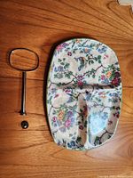 Platter top view disassembled showing three partitions, floral pattern, handle components