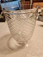 Overall view of clear diamond-pattern glass vase