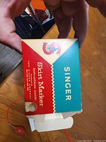 Singer branded box top