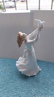 Front view of Royal Doulton Thinking Of You figurine showing woman with dove