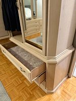 Armoire base with drawer open, showing mirror on upper section