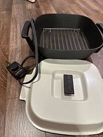 Overall view of pan, cord, lid and rack