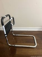 side view of bed assist rail showing U-shaped base and adjustable legs