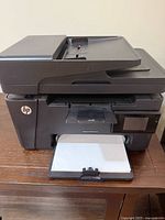 Front view of HP LaserJet Pro MFP M127fw with paper tray and ADF visible