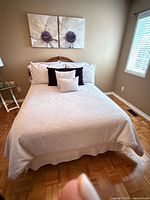 Full bed setup with bedding and pillows