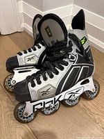 Left side view of both skates showing boot design, chassis branding and wheel configuration