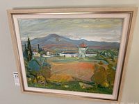 Framed oil painting on wall showing full view