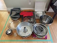 All bakeware and tools grouped on floor