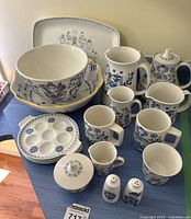 Group shot of all fifteen ceramic pieces on table