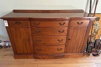 front view of wood serpentine buffet dresser