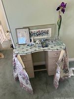 full view of dressing table with décor on top