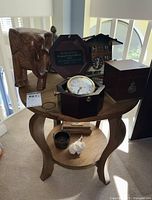 overview showing wood side table and top-shelf decor items