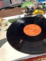 Close-up of a vinyl LP surface showing wear and scratches