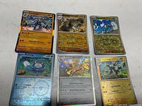 All six holographic Pokémon cards laid out