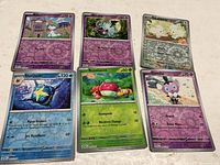 Six Pokémon reverse-holo cards displayed front view