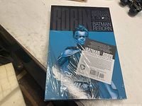 Shrink-wrapped front showing Robin artwork and product insert