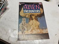 Front cover of Alien Encounters issue 8 showing publisher, price and artwork