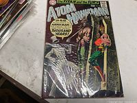 Front cover of The Atom and Hawkman #44 in plastic sleeve showing artwork and 15¢ price