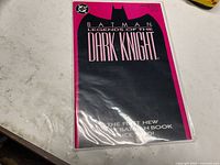 Front view of sealed Batman: Legends of the Dark Knight #1 comic in polybag