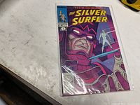 Front cover showing The Silver Surfer issue #1 in protective sleeve