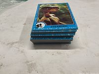 Side view of stacked E.T. cards showing top card "Stranded!"