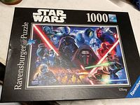 Front of puzzle box showing artwork, branding, piece count and Disney logo