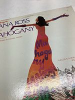 Front album cover with title, Diana Ross illustration
