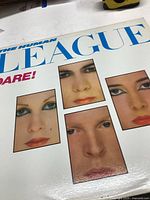 Front cover of The Human League Dare! LP with five face portraits and title text