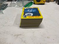 Stack of yellow-border RoboCop trading cards