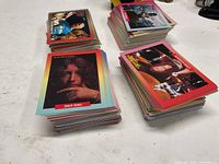 Stacks of RockCards trading cards showing multicolour borders