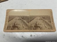 Front of stereoview card with twin images and printed captions
