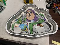 Top view of Buzz Lightyear cake pan with color insert inside