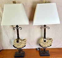 Pair of lamps full view showing bases, fossils, stands, shades