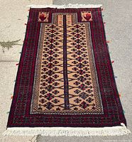 Full view of rug laid flat showing complete design, colors and condition