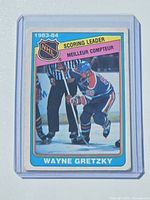 Front view of Wayne Gretzky 1983-84 Scoring Leader O-Pee-Chee card in holder
