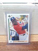 Front of Michael Jordan SP1 Upper Deck card in protective sleeve and top loader
