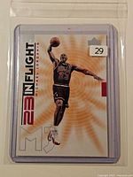 Front view of the 1998 Upper Deck Michael Jordan “23 In Flight” card in protective sleeve