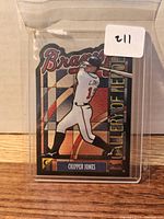 Front view of the 1999 Topps Gallery of Heroes Chipper Jones stained glass card in sleeve