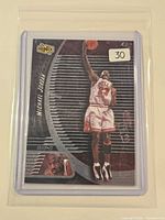 Front view of the 1999 Upper Deck Ionix Michael Jordan card in protective sleeve