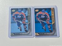 Front view of both Wayne Gretzky Shining Stars cards in protective holders