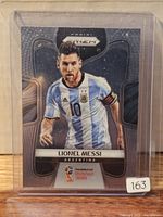 Front of 2018 Panini Prizm Lionel Messi card in sleeve and top loader