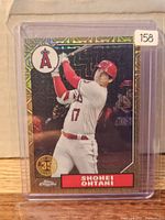 Front view of Shohei Ohtani 2022 Topps 35th Anniversary Mojo Refractor card in top loader