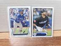 Two Jose Bautista baseball cards side by side