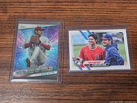 Front view of two sleeved Shohei Ohtani Topps baseball cards