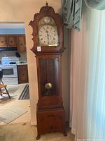 Full view of tall case clock showing overall design and size