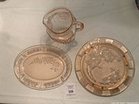 Overall lot view showing pitcher, oval platter, round plate