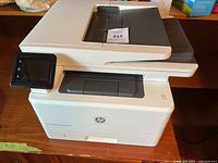 Full left-front view of HP LaserJet Pro MFP M426fdw printer showing touchscreen and overall condition